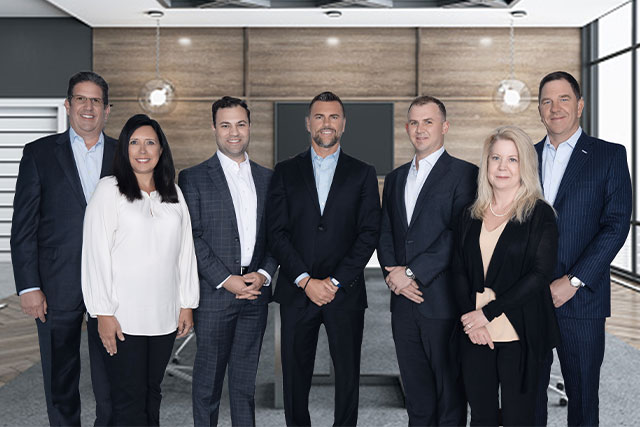 Corporate executives picture, dressed in suits and professional attire